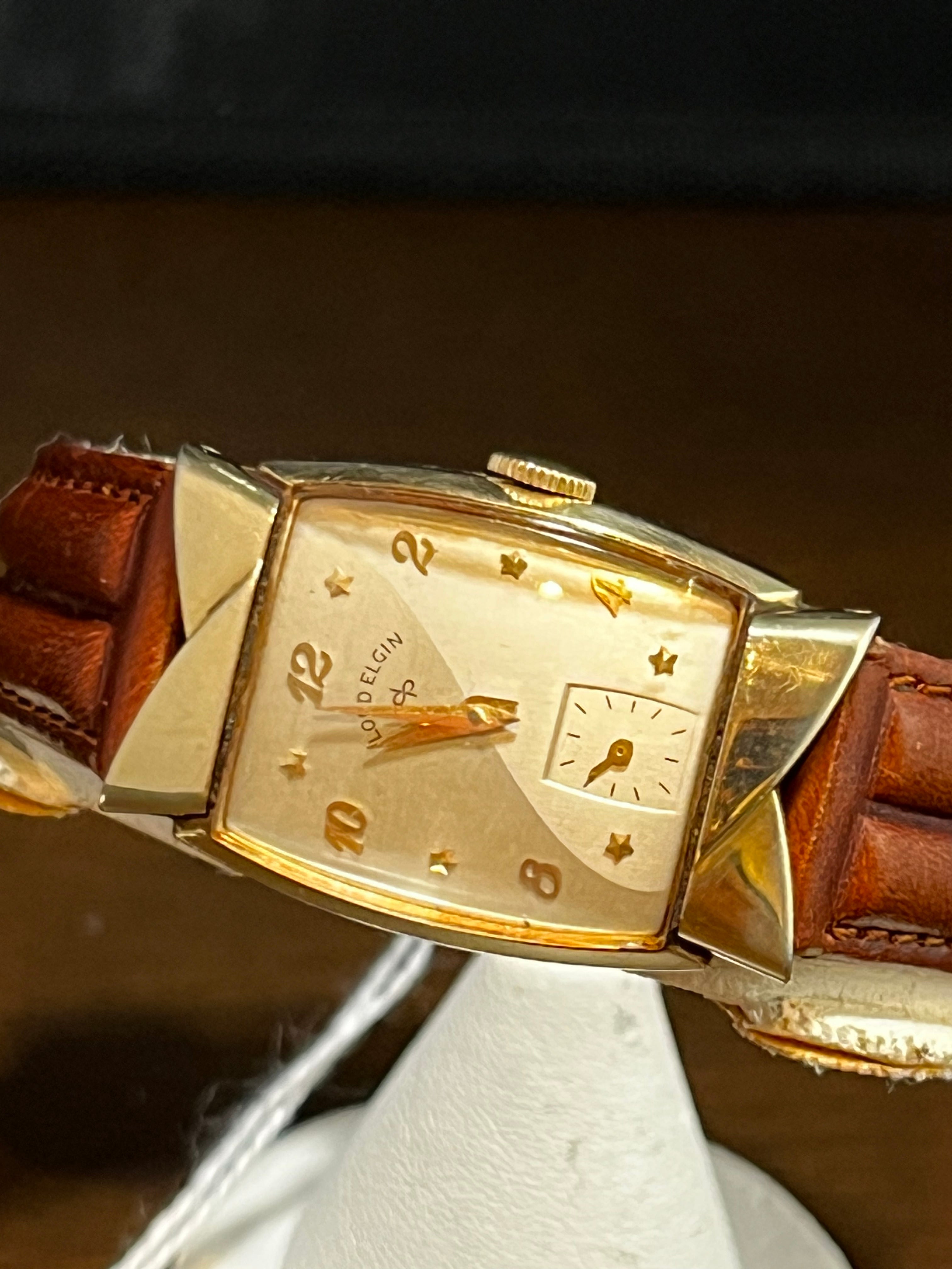 Please help identify this Elgin watch for me! Wanting to buy this vintage  Elgin from my dad, but don't know the model ergo I don't know it's worth.  I've seen similar Elgin's